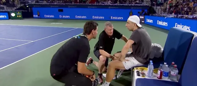 Griekspoor receiving medical treatment from physiotherapists during his match in Dubai against Rublev, that he finally won
